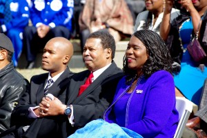 TSU President, Dr. Glenda Glover (R), watches as students display well-wishes during a special ceremony following the presidential procession to the amphitheater. Also pictured with Dr. Glover are her son, Dr. Charles Glover II (L), and her husband, Charles Glover. (photo by Rick DelaHaya, TSU Media Relations)