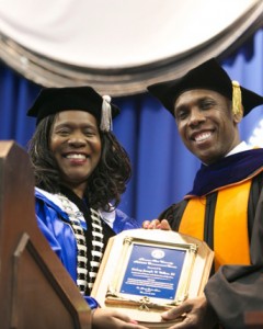Bishop Joseph W. Walker III (left) , pastor of Nashville’s Mt. Zion Baptist Church, receives a plaque of appreciation from TSU President, Dr. Glenda Glover. Walker provided the commencement address for the Fall 2013 graduation ceremony. (photo by John Cross, TSU Creative Services) 