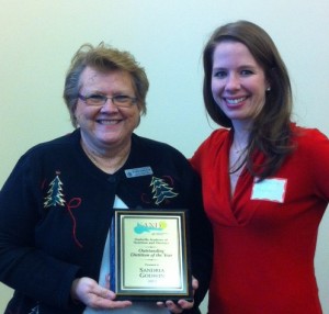 Dr. Sandria Godwin receives the Outstanding Dietitian of the Year award from NAND president, Katherine Fowler. Godwin received the award Dec. 10 for promoting optimal health in the community. (courtesy photo)