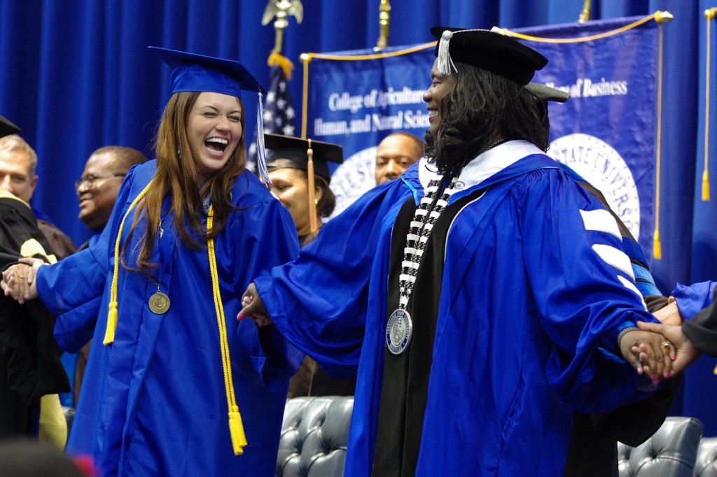 Kayla Arroyo (left), Academic Excellence Award recipient, shares a candid moment with TSU President, Dr. Glenda Baskin Glover during the commencement ceremony Dec. 14 in the Gentry Center.