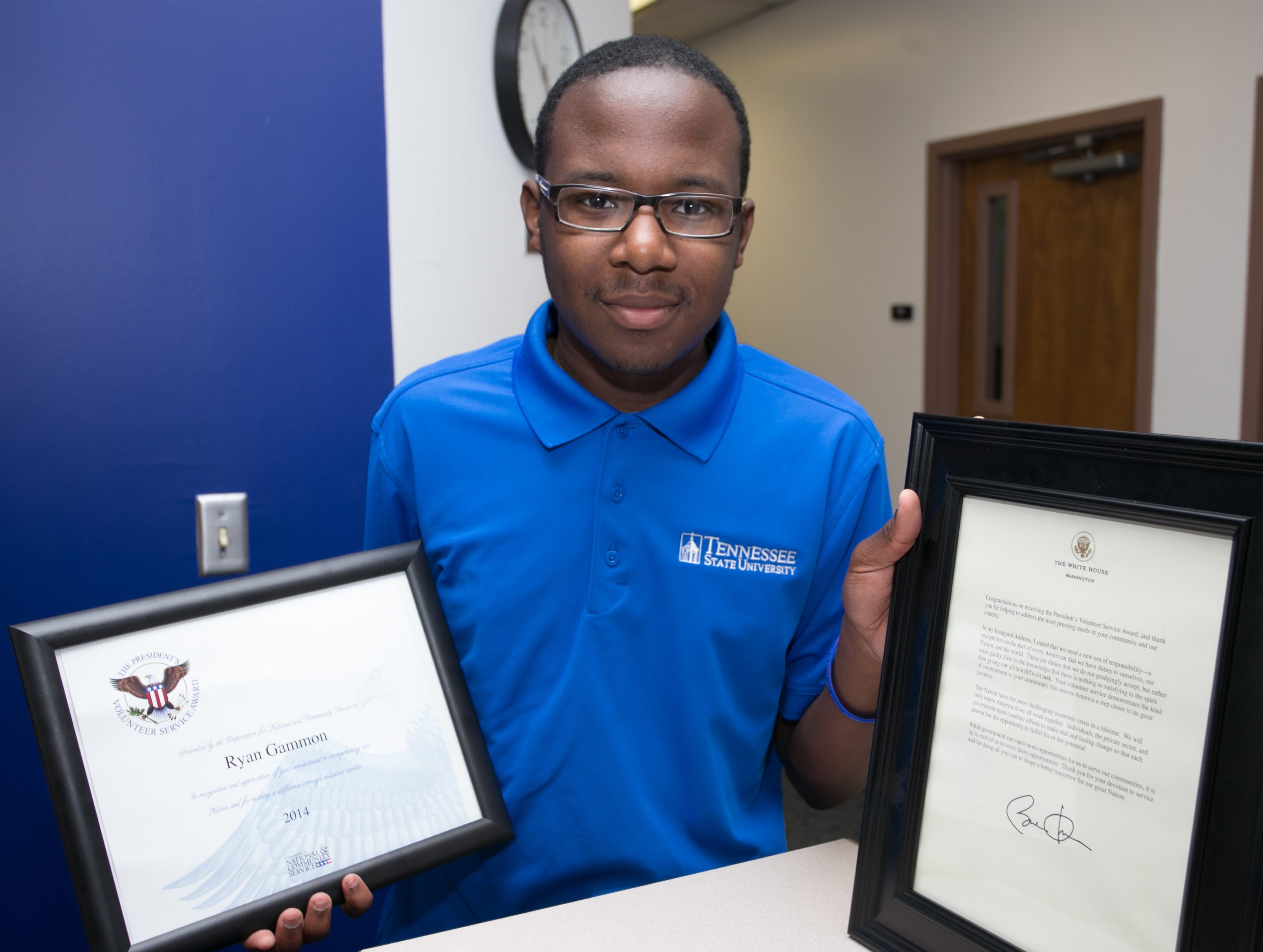 Ryan Gammon, a junior majoring in Criminal Justice, displays his letter from Barack Obama congratulating him on his President’s Volunteer Service Award along with an award citation. (photo by John Cross. TSU Media Relations)