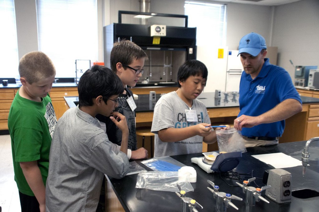 Dr. Jason de Koff, assistant professor of Bioenergy Crop Production, instructs middle school students while they practice a handheld biofuel conversion. The College of Agriculture, Human and Natural Sciences hosted a series of Biofuel Technology workshops for tips, pointers and helpful information on teaching the emerging field of biofuels. (courtesy photo)