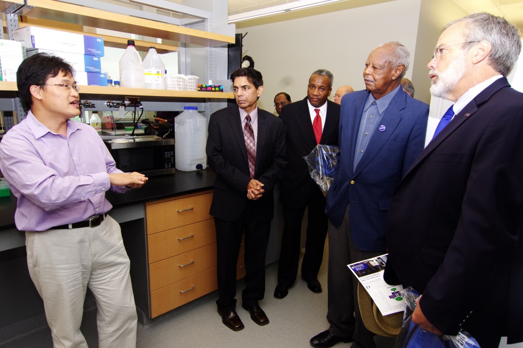 Dr. Hongwei Si, Assistant Professor of Food Chemistry, explains some of the research projects going on in the Food Biosciences and Technology Lab, as visitors, including Dean Chandra Reddy, and TBR Chancellor John Morgan, far right, listen. (photo by Rick Delahaya, TSU Media Relations) 