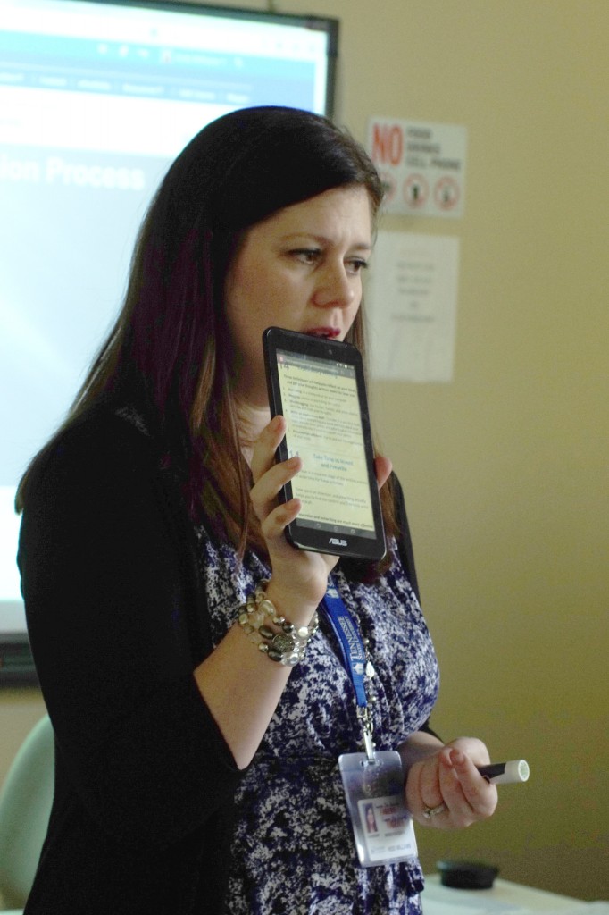Heidi Williams, English professor at Tennessee State University, displays the required textbook readings on a mobile device to her freshman English I class. Tablets were distributed to incoming freshmen as part of the University’s Book Bundle Initiative aimed at lowering costs of text books. Under the new program, students will pay a flat fee of $365 per semester that is included in their tuition and fees, and have access to the required digital textbooks for classes taken. (photo by Rick DelaHaya, TSU Media Relations)   