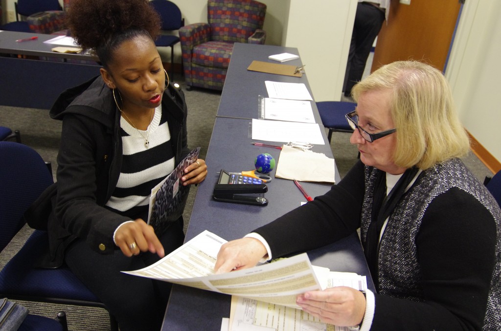 Monique Miller (left), a sophomore Nursing major at Tennessee State University, discusses the passport application process with Linda Coffield, passport specialist. The University held a special passport fair  to help make international travel easier for students, faculty and staff. (photo by Rick DelaHaya, TSU Media Relations) 