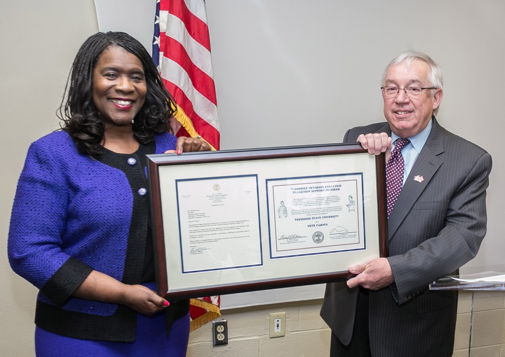 Tom Morrison, the Tennessee Higher Education Commission Assistant Executive Director for Veterans Education, presents the title and certificate of designation to President Glenda Glover, officially declaring TSU a certified "Vets Campus."  (photo by John Cross, TSU Media Relations) 