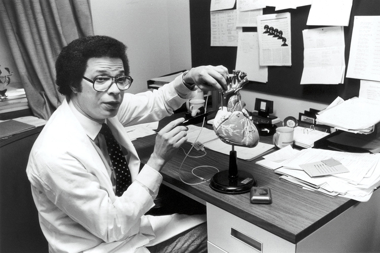 Dr. Watkins demonstrates the automatic defibrillator on a heart model. He performed the world's first implantation of the device in a human in 1980, and today more than a million people have received this life saving device. (courtesy photo)